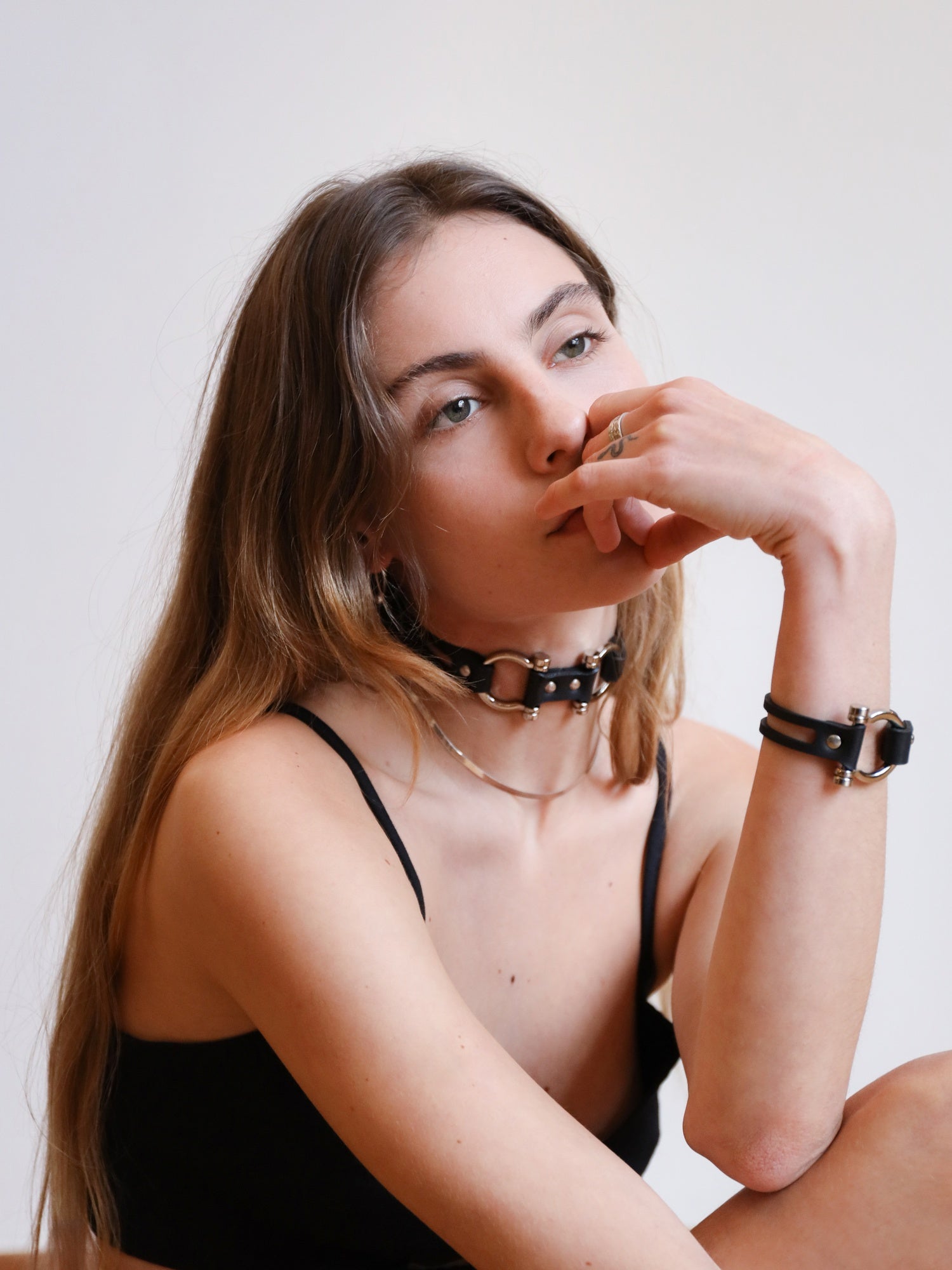 Dara casually sitting with the Dakota choker and cuff by Baby turns Blue