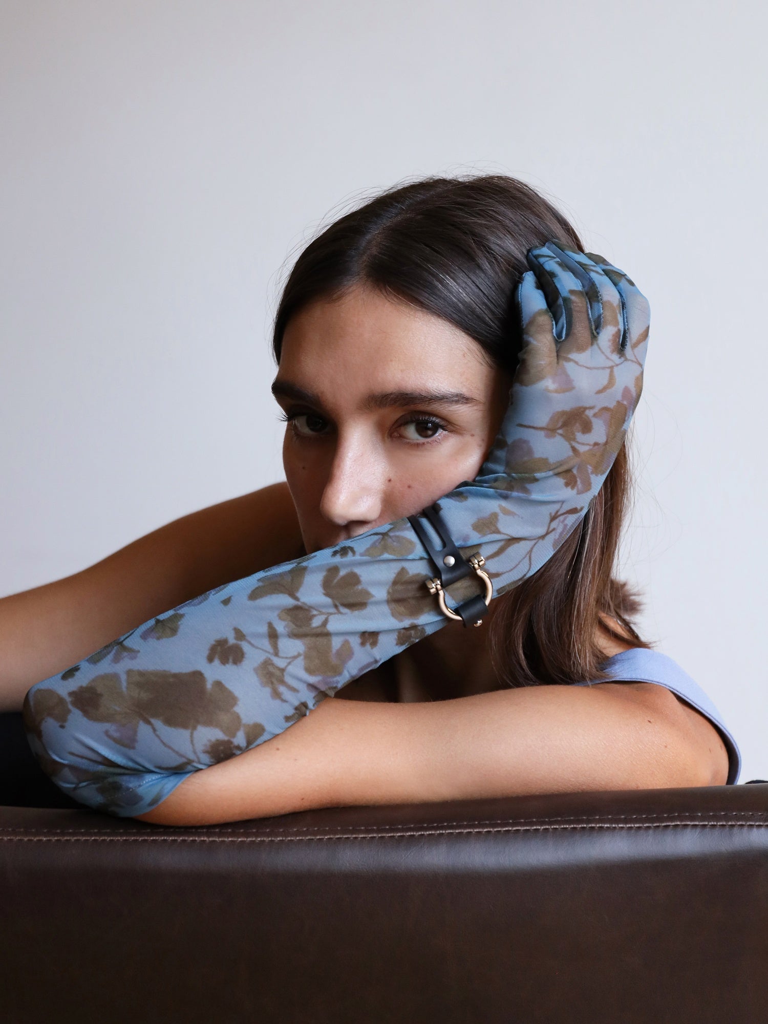 Portrait of Manon wearing the Dakota cuff over a blue glove by Baby turns Blue Paris