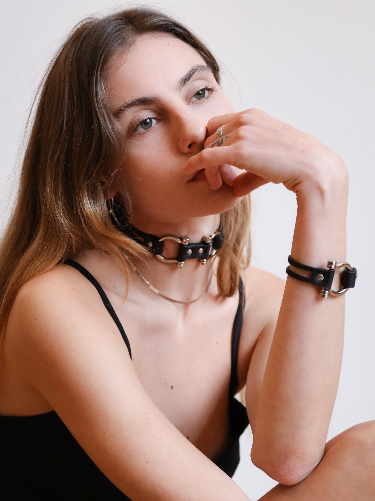 Side view of Dara posing with the plant-based Dakota cuff and choker by Baby turns Blue Paris