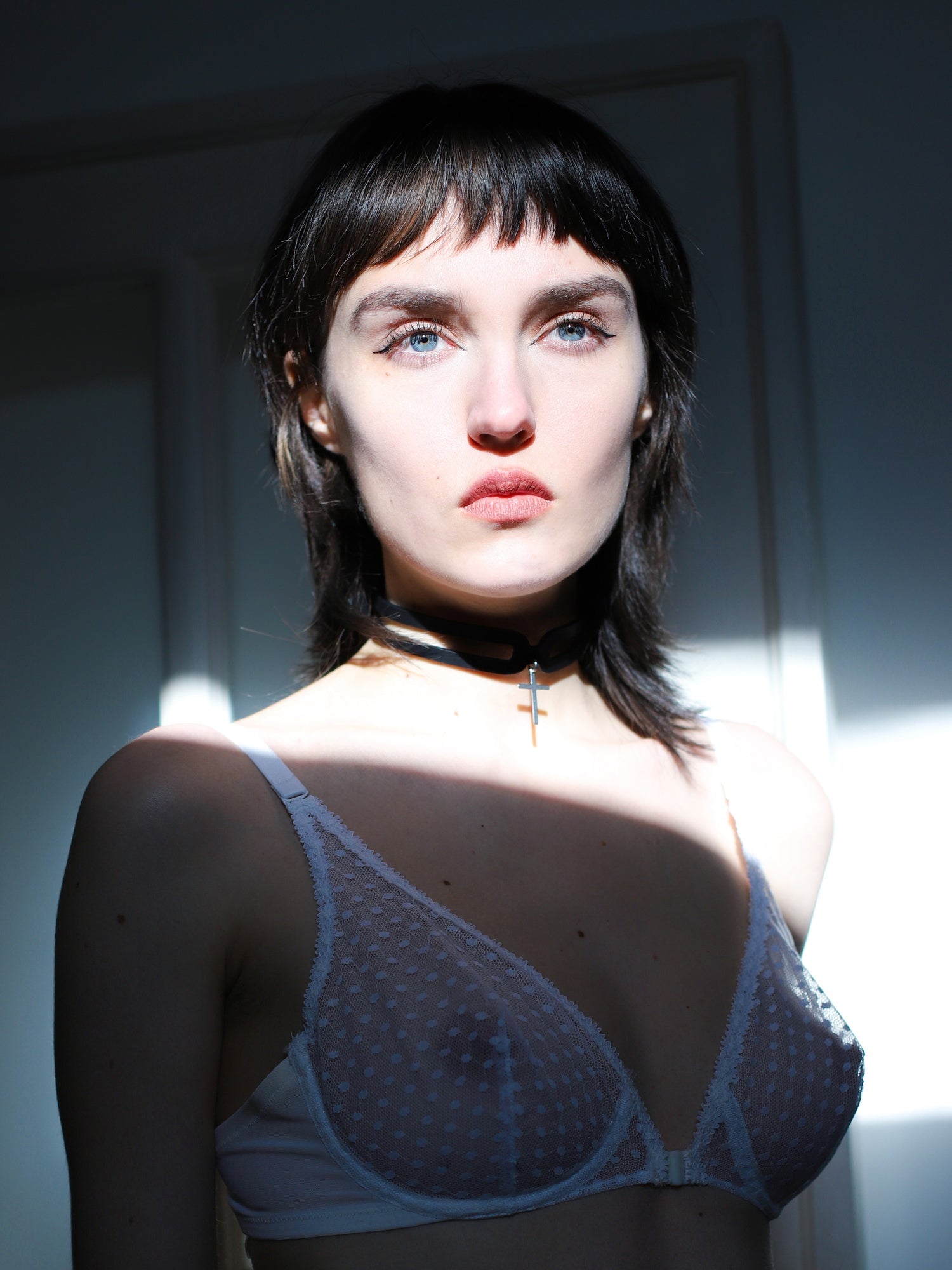 Marie in the sun posing with the Hope Cross eco-friendly choker by Baby turns Blue Paris
