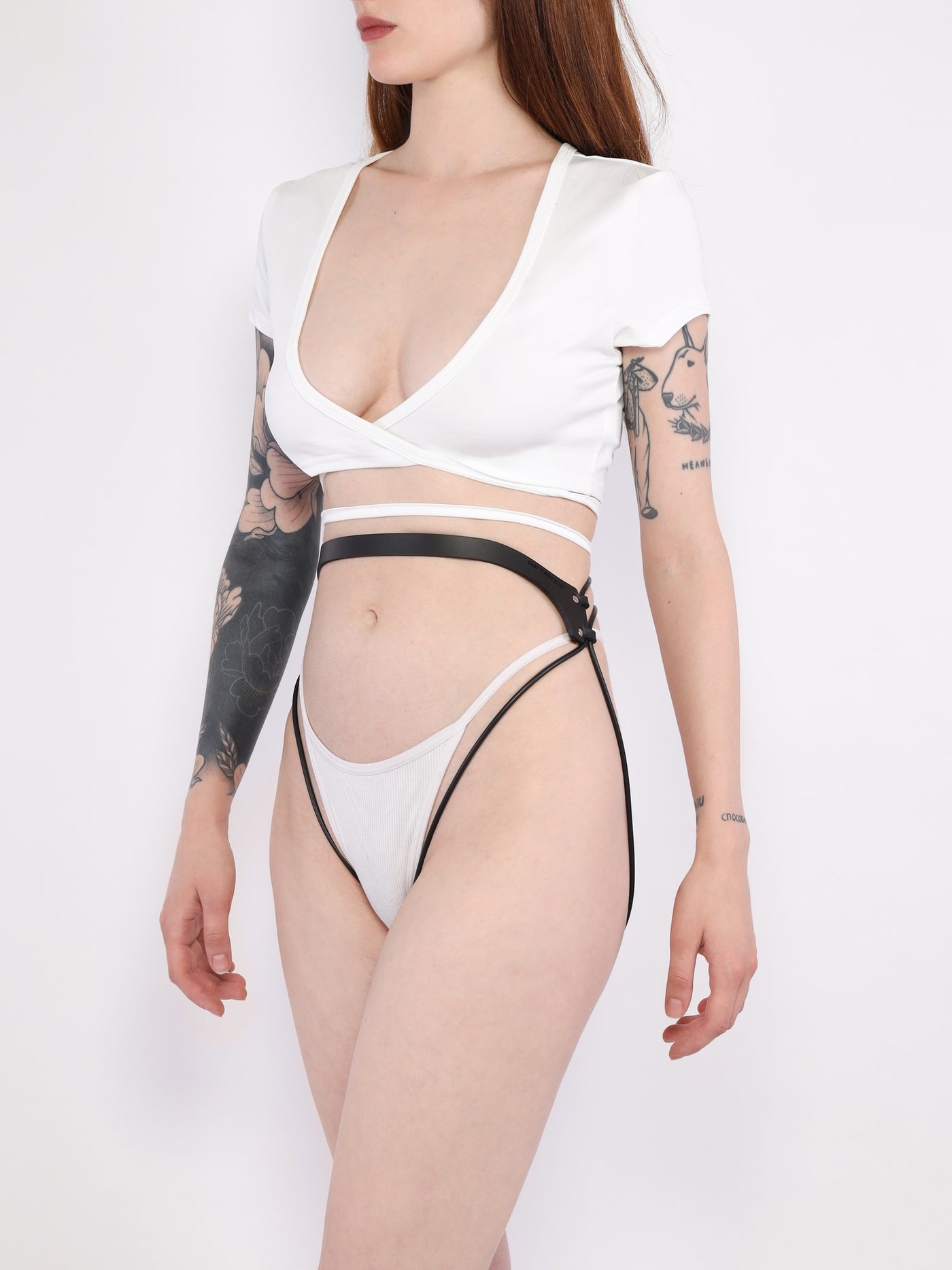 Side view of a model wearing the vegan Pulse garter belt by Baby turns Blue Paris
