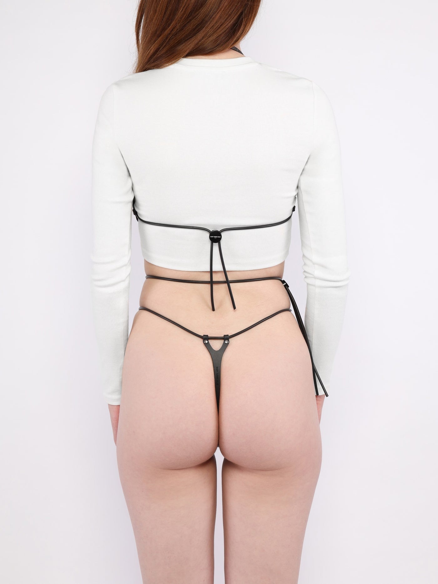 Back view of model wearing the vegan Pulse set by Baby turns Blue Paris