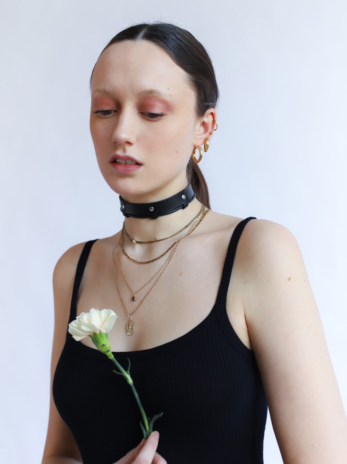 Tessa featuring the Cherry choker holding a flower by Baby turns Blue Paris