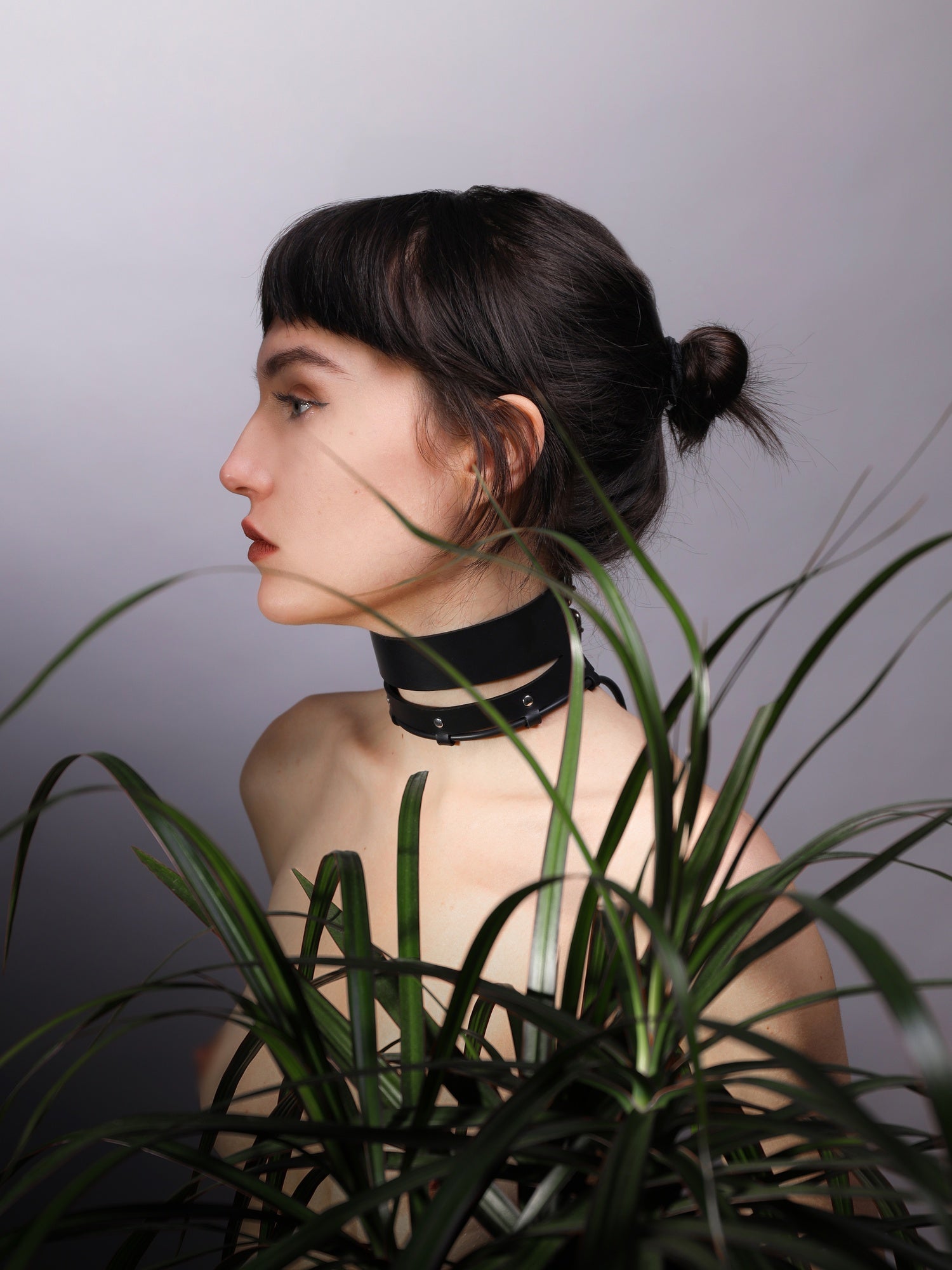 Maria behind plants wearing the Dawn choker by Baby turns Blue Paris