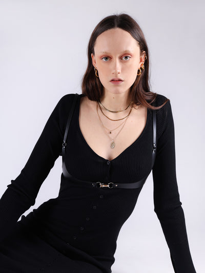 Tessa wearing the beautiful Dolores harness on top of a black dress
