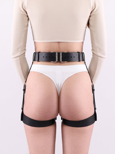 Back view of a model wearing the vegan Gum garter belt by Baby turns Blue Paris